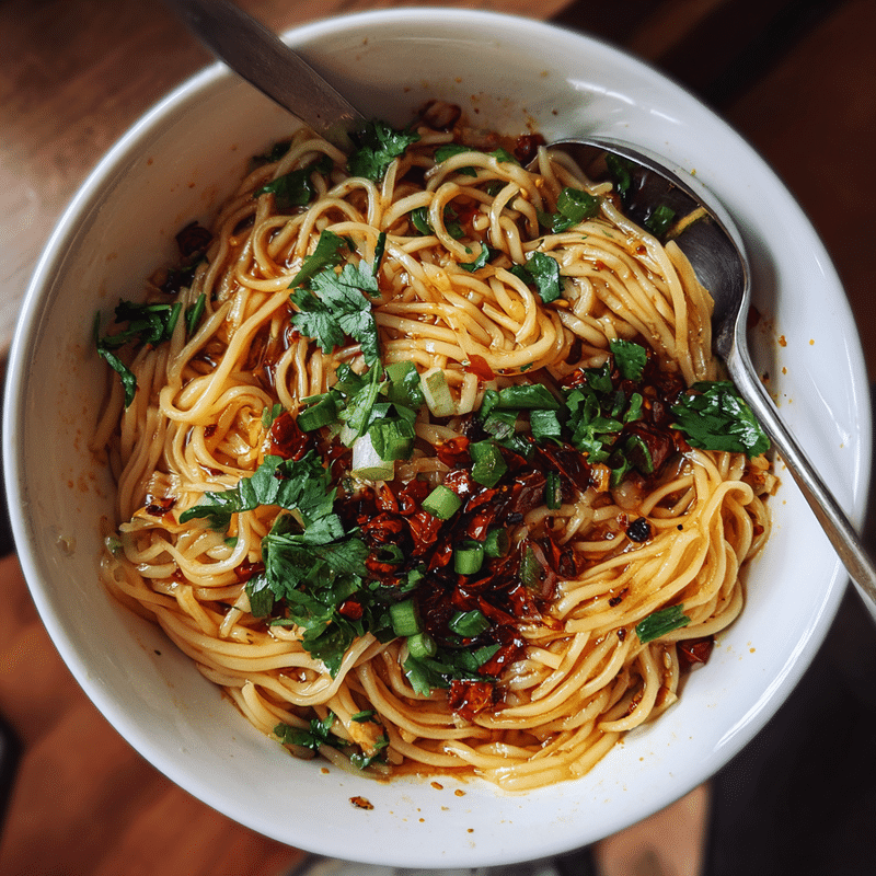Here are 5 SEO-friendly blog titles for "Spicy Garlic Chili Oil Noodles": 1. Spicy Garlic Chili Oil Noodles: The Best 5-Minute Weeknight Meal 2. Why Spicy Garlic Chili Oil Noodles Should Be Your Next Takeout Swap 3. How to Make Restaurant-Quality Spicy Garlic
