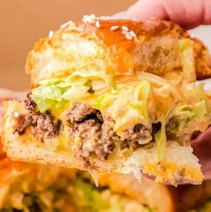 Delicious Big Mac Sliders served on a plate with toppings.