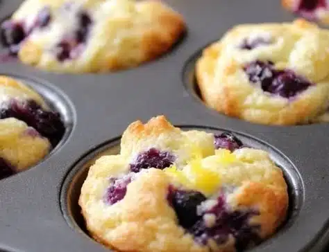 Blueberry and lemon zest cottage cheese bites on a wooden serving board