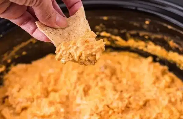 Creamy Crockpot Buffalo Chicken Dip served in a bowl with chips.
