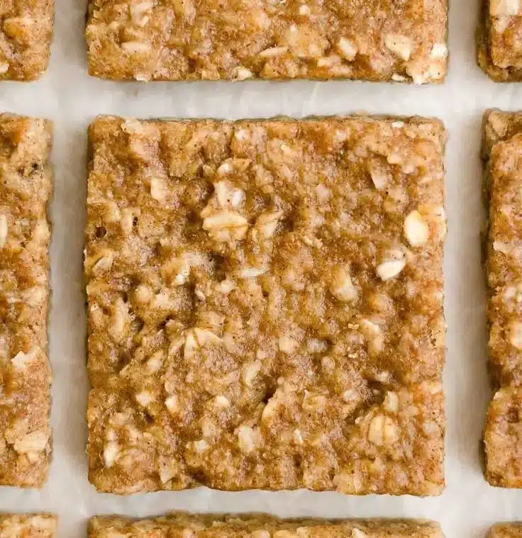 Healthy oatmeal breakfast bars filled with nuts and fruits for a nutritious snack.