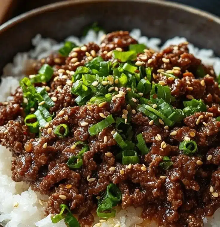 Delicious Korean Ground Beef Bowl topped with green onions and sesame seeds