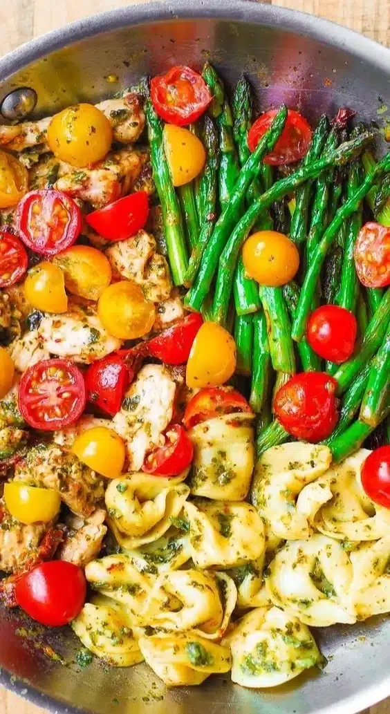 One-Pan Pesto Chicken with tortellini and mixed vegetables for a delicious meal
