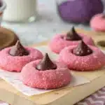 Delicious strawberry kiss cookies decorated with Hershey's kisses.