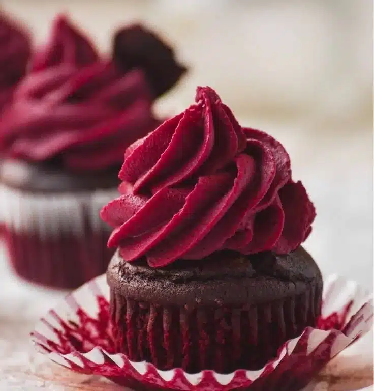 Delicious Chocolate Beet Cupcakes topped with chocolate frosting and beet sprinkles