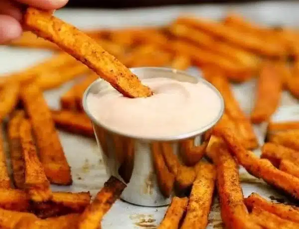 Crispy baked sweet potato fries served in a bowl