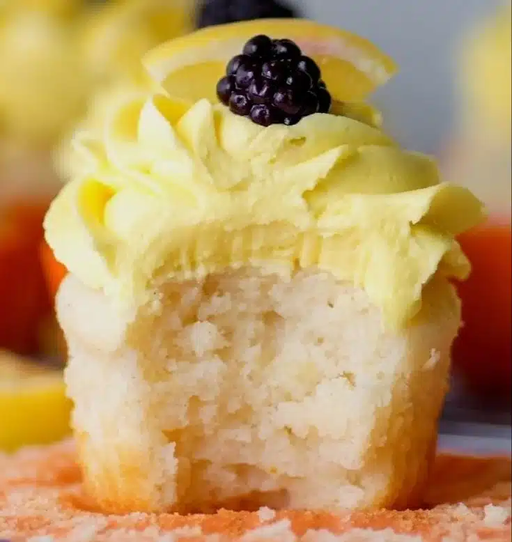 Gluten free lemon cupcakes topped with lemon zest and frosting