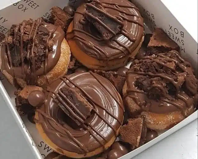 A variety of gourmet desserts beautifully presented on a dessert table.