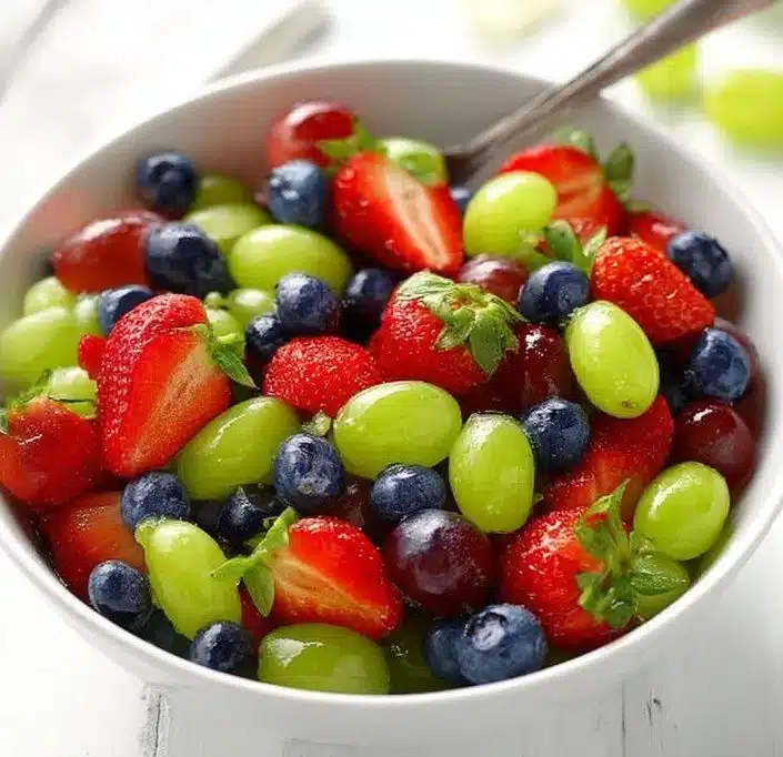 Colorful Honey Lime Fruit Salad with mixed fruits and zesty dressing