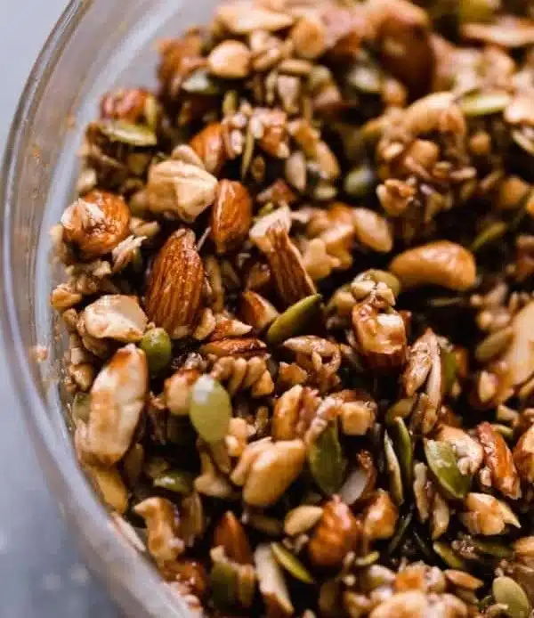 Delicious Paleo Granola made with honey and cinnamon in a wooden bowl