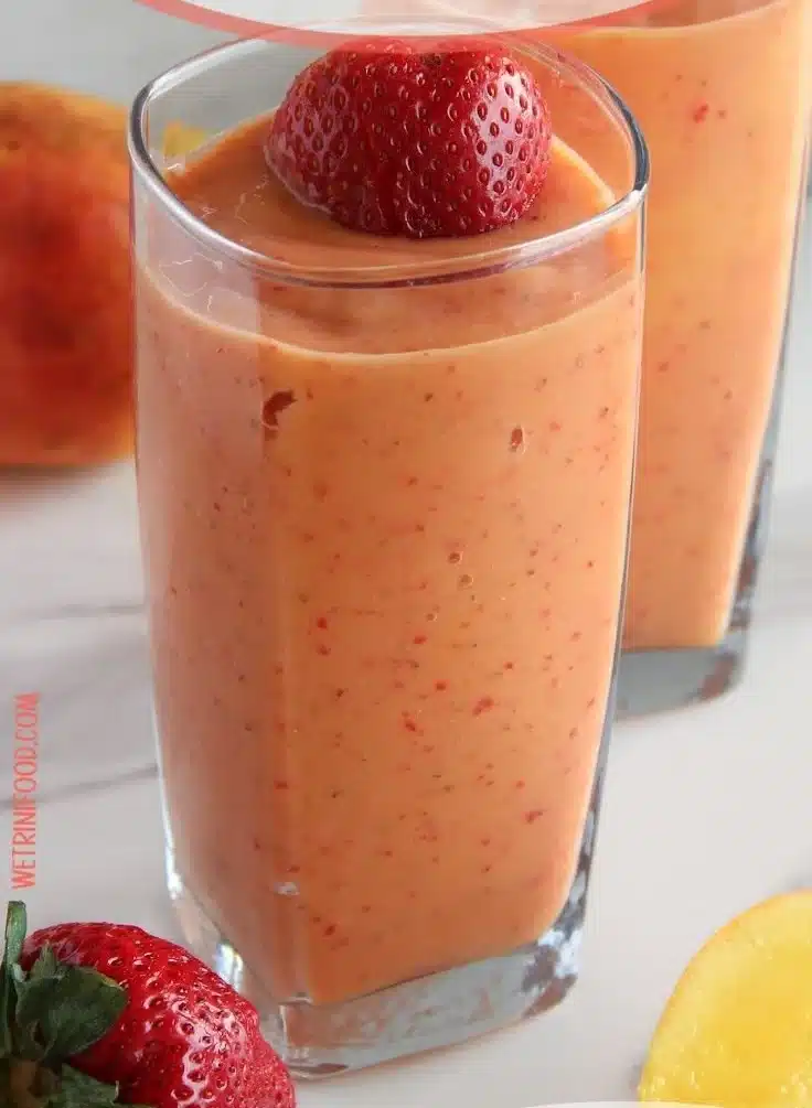 A colorful refreshing fruit smoothie made with fresh fruits and yogurt