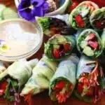 Colorful assortment of homemade spring rolls filled with fresh vegetables and herbs