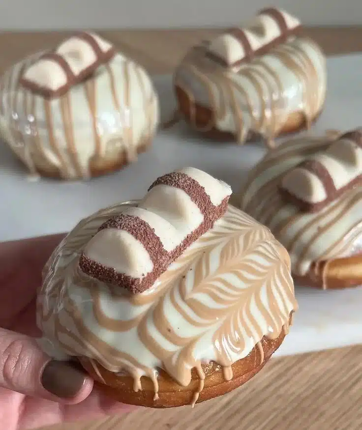 Delicious White Kinder Bueno Sufganiyot donuts filled with creamy chocolate hazelnut.