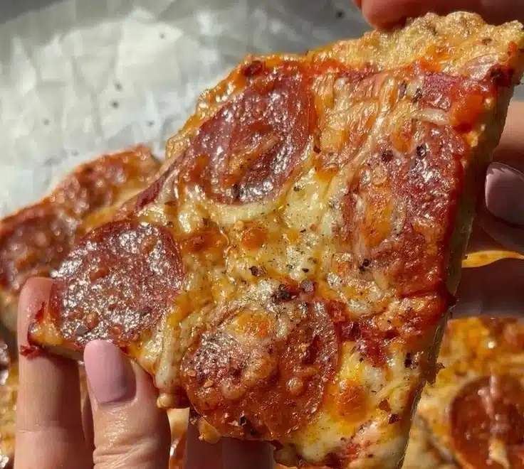 Chicken crust pizza topped with fresh vegetables and melted cheese