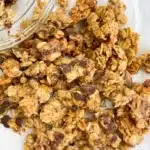 Bowl of Chunky Monkey Granola featuring oats, bananas, nuts, and chocolate.
