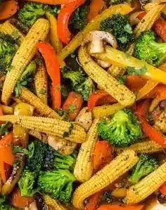 A colorful one-pan vegetable stir fry with fresh vegetables and soy sauce.
