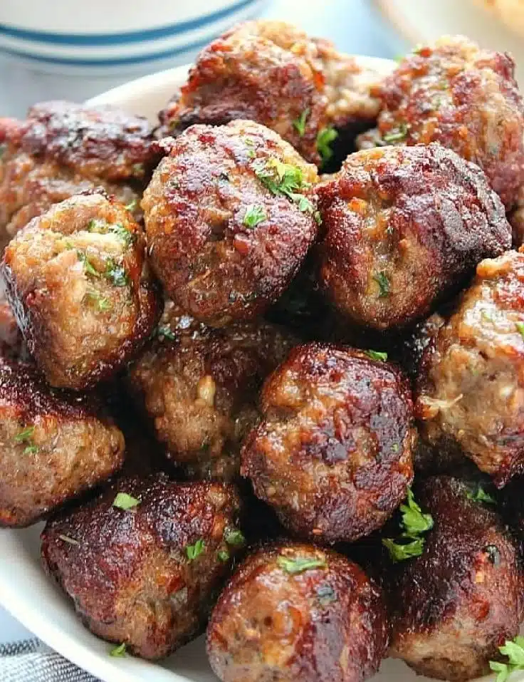 Delicious Greek meatballs (Keftedes) served with fresh herbs and spices