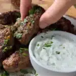 Deliciously grilled kafta, kofta, and kebabs served with fresh vegetables.