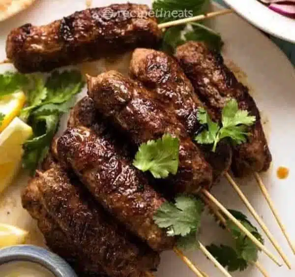 Delicious Lamb Koftas served with creamy yoghurt dressing on a plate