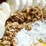 Mango Banana Smoothie Bowl topped with fresh fruits and granola