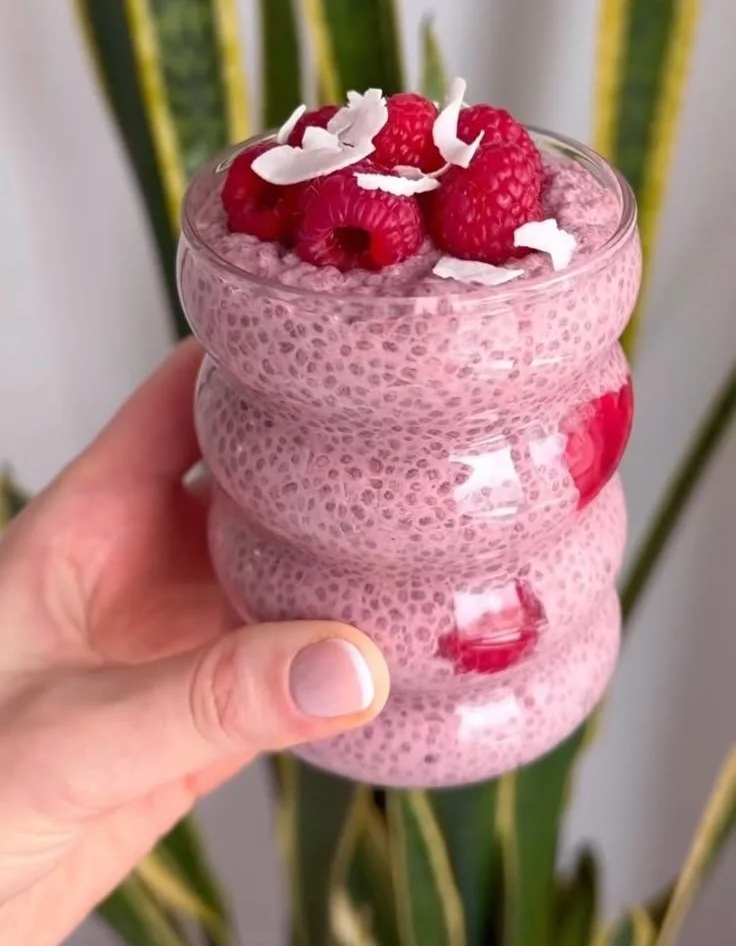 Delicious Raspberry Chia Pudding served in a bowl with fresh raspberries