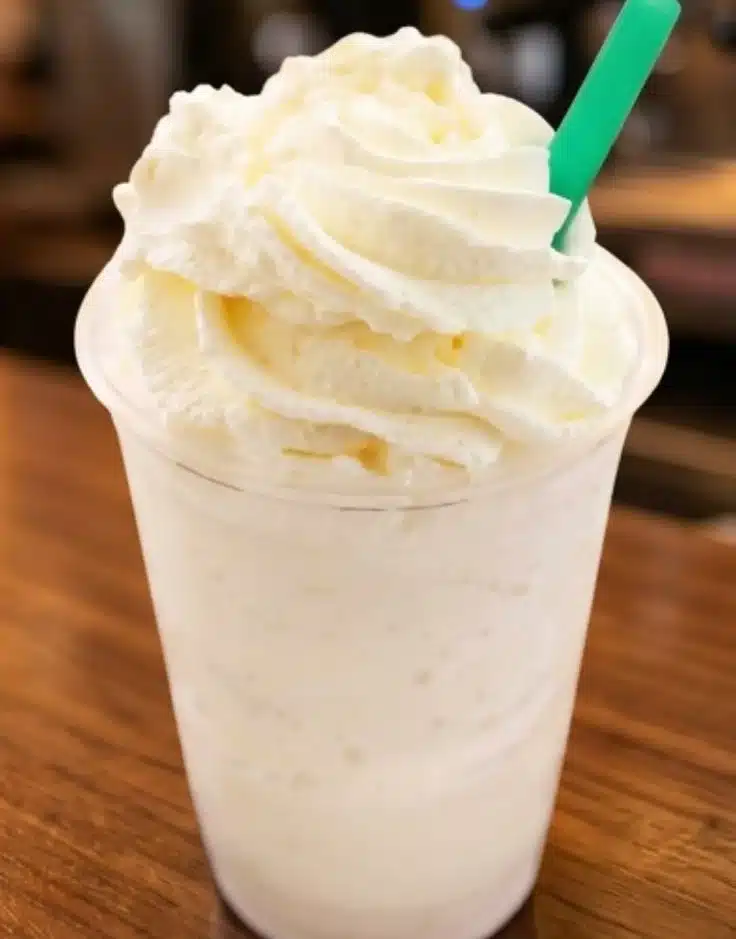 Delicious Vanilla Bean Frappuccino topped with whipped cream and vanilla drizzle.